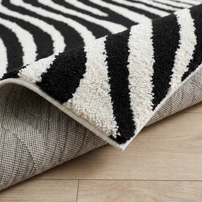 Alfombra Domus con estampado de cebra moderna en blanco y negro