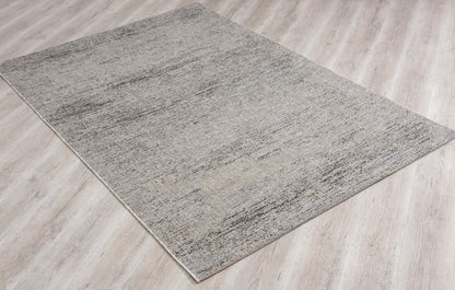 Naira Distressed Solid Modern Grey and Blue Indoor Rug
