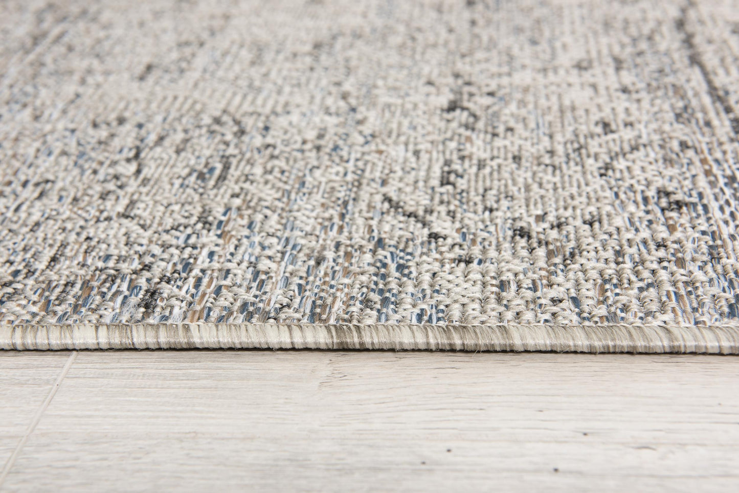 Naira Distressed Solid Modern Grey and Blue Indoor Rug