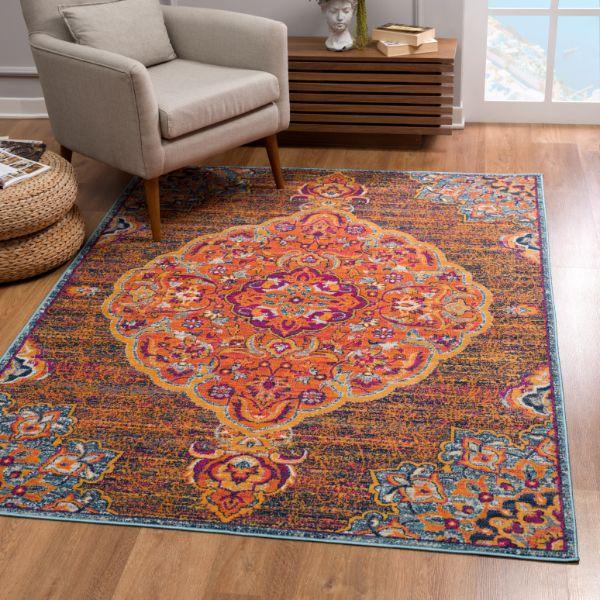 Alfombra de interior tradicional Floria Floral Medallion, azul y rosa